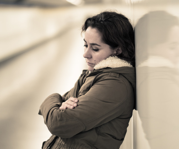 Hopeless and exhausted woman suffering depression and anxiety in subway tunnel in Work-life balance issues Negative body image Financial troubles and Stressful life events Mental health and loos of loved one.